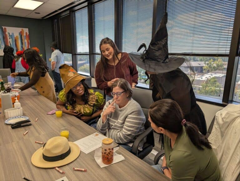 A group of coworkers dressed up for Halloween