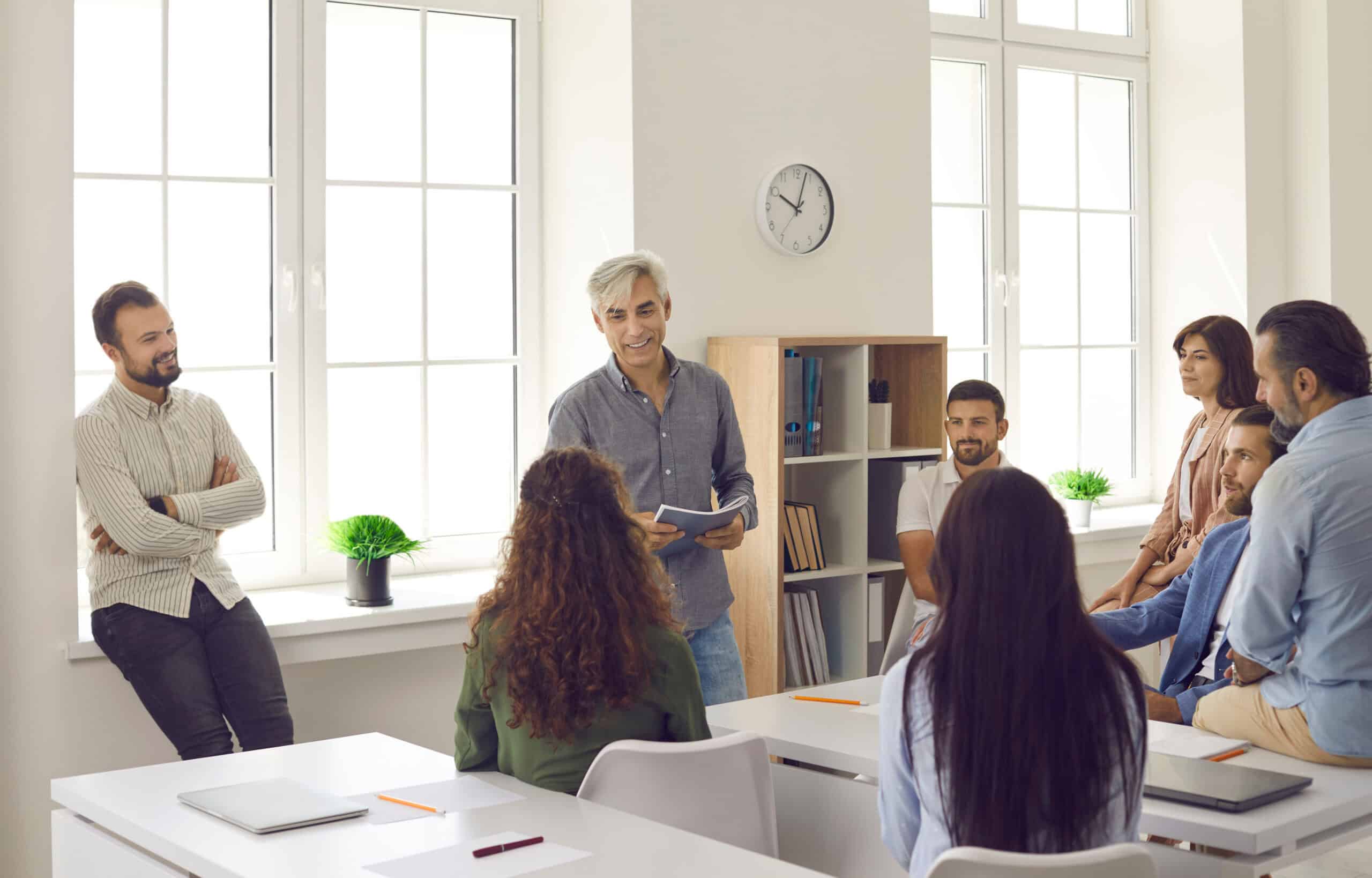 Teachers meeting together in a classroom setting