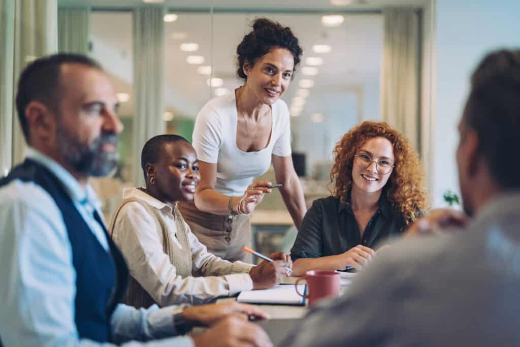 A group of people gathered in a meeting room